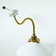 Swan neck wall light in smooth opaline and brass, early 20th century.