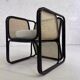 Cubic armchair in black rattan and canework