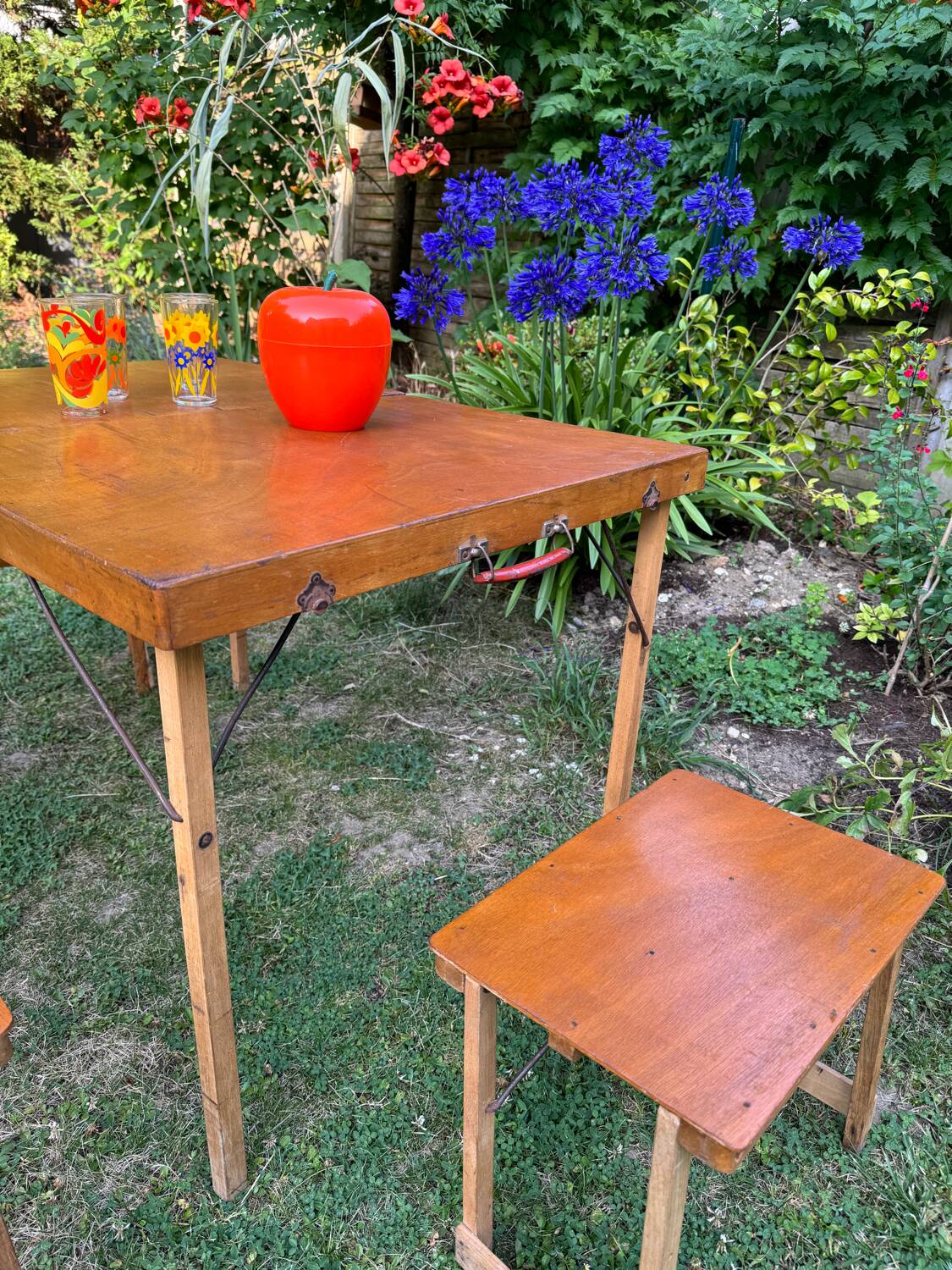 Old suitcase, table and stools, vintage wooden picnic