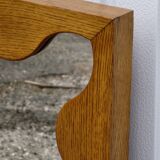 Large antique mirror with an oak frame.