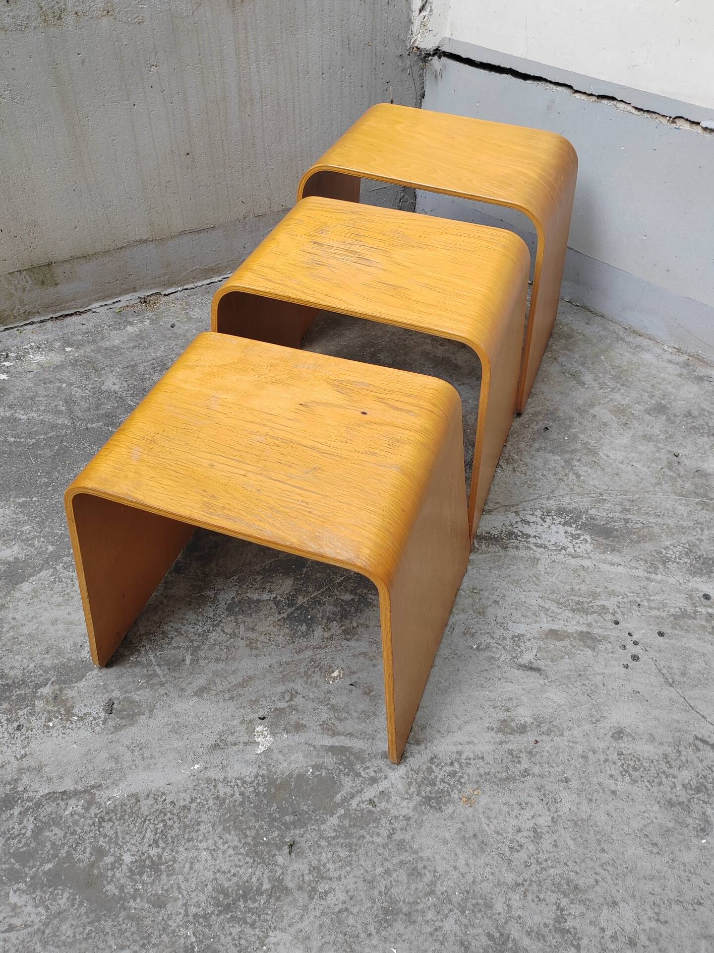 Nested tables with curved wood