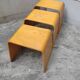 Nested tables with curved wood