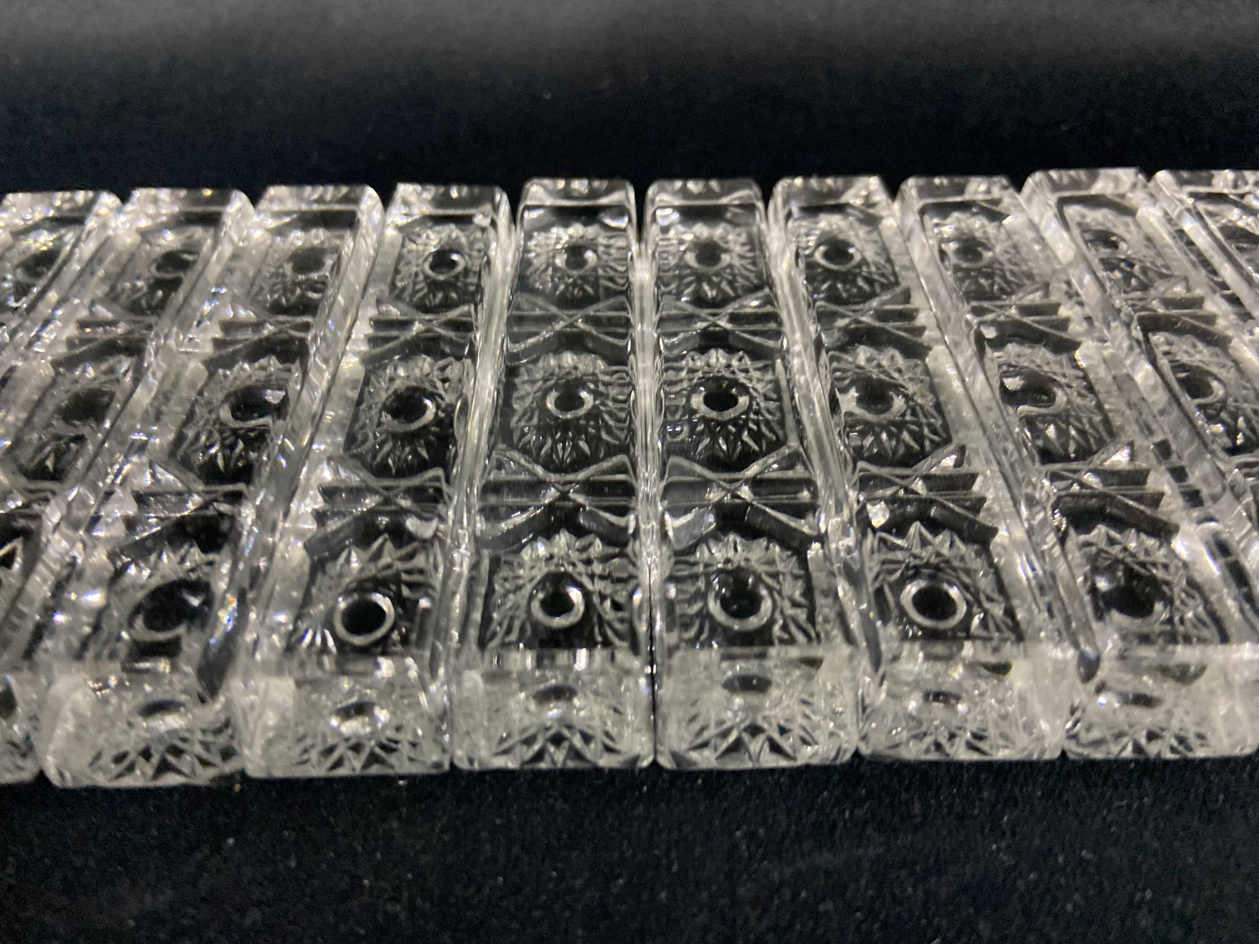 Set of 12 molded glass or crystal knife rests with diamond point decor