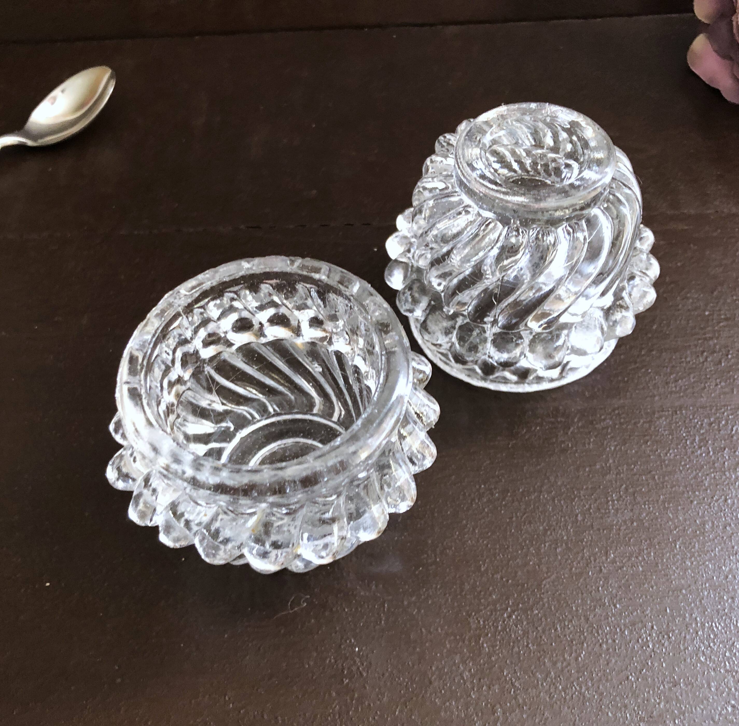 Glass salt and pepper shaker set with vintage serving spoon