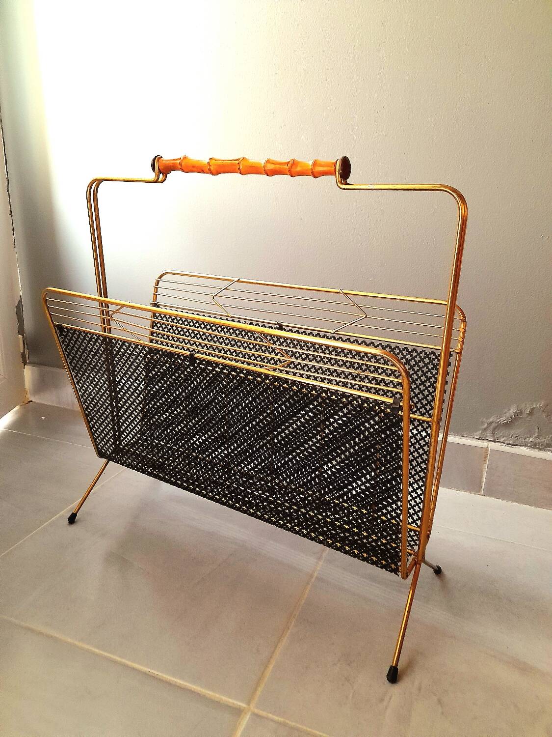 Perforated metal magazine rack 1950