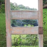Mirror (3 panels) on door.