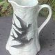 Jade green ceramic barbotine vase with swallows.