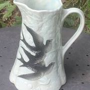 Jade green ceramic barbotine vase with swallows.