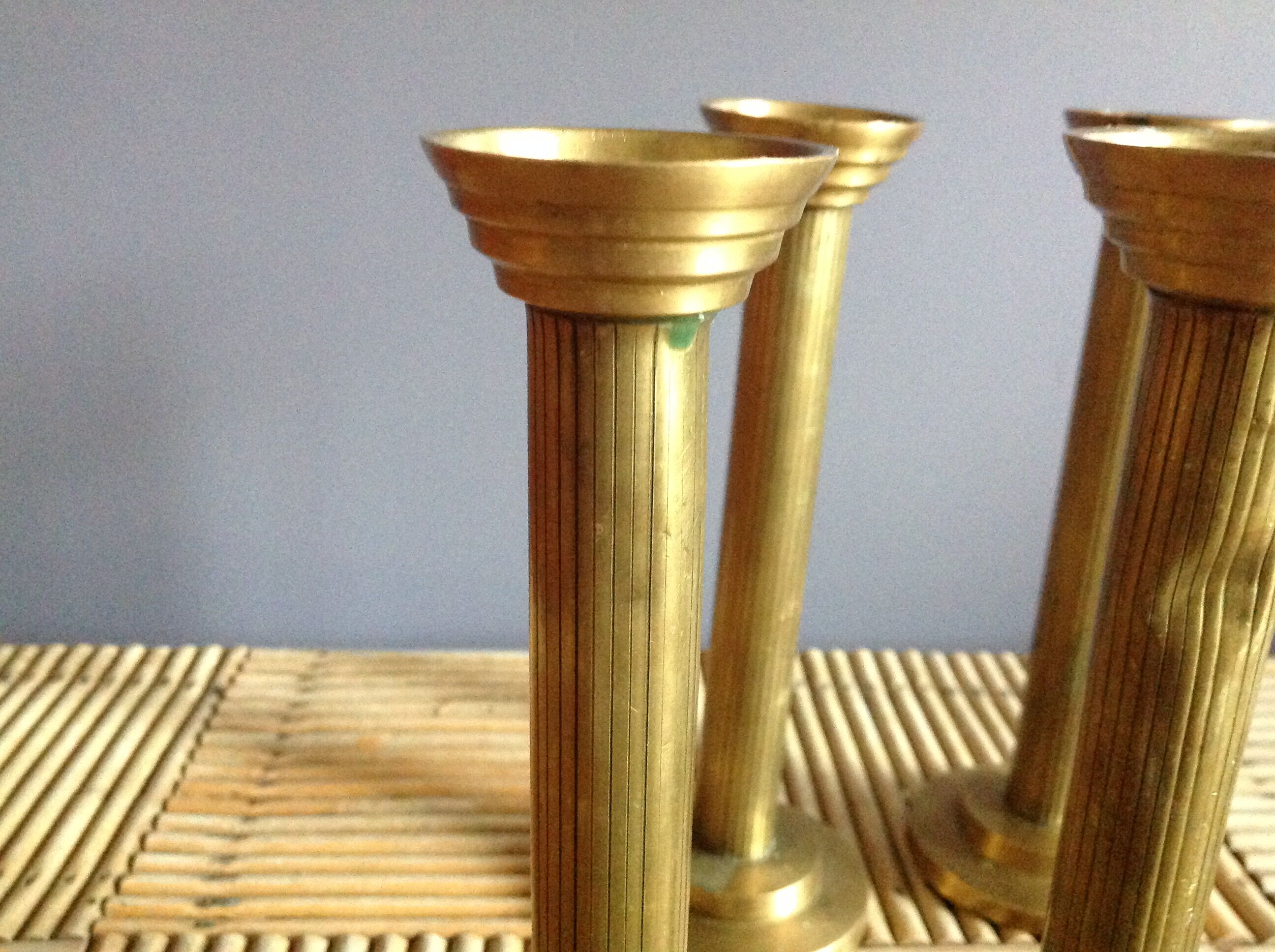 Series of 4 brass candlesticks