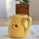 Vintage yellow ceramic milk jug – Hand-painted floral pattern