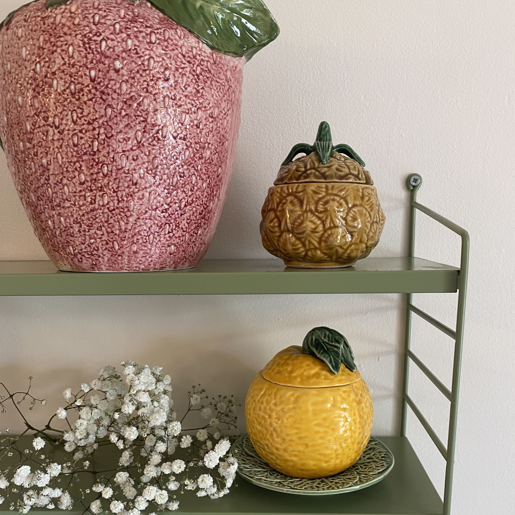 Set of ceramic fruits, a strawberry decanter and two lemon and pineapple jam jars