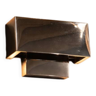 French-origin wall light, made of stainless steel.