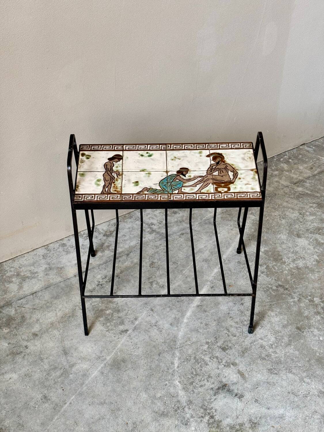 Vintage magazine table with Greek mythology motif.