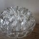 Large round glass flower frog vase with 19 holes.