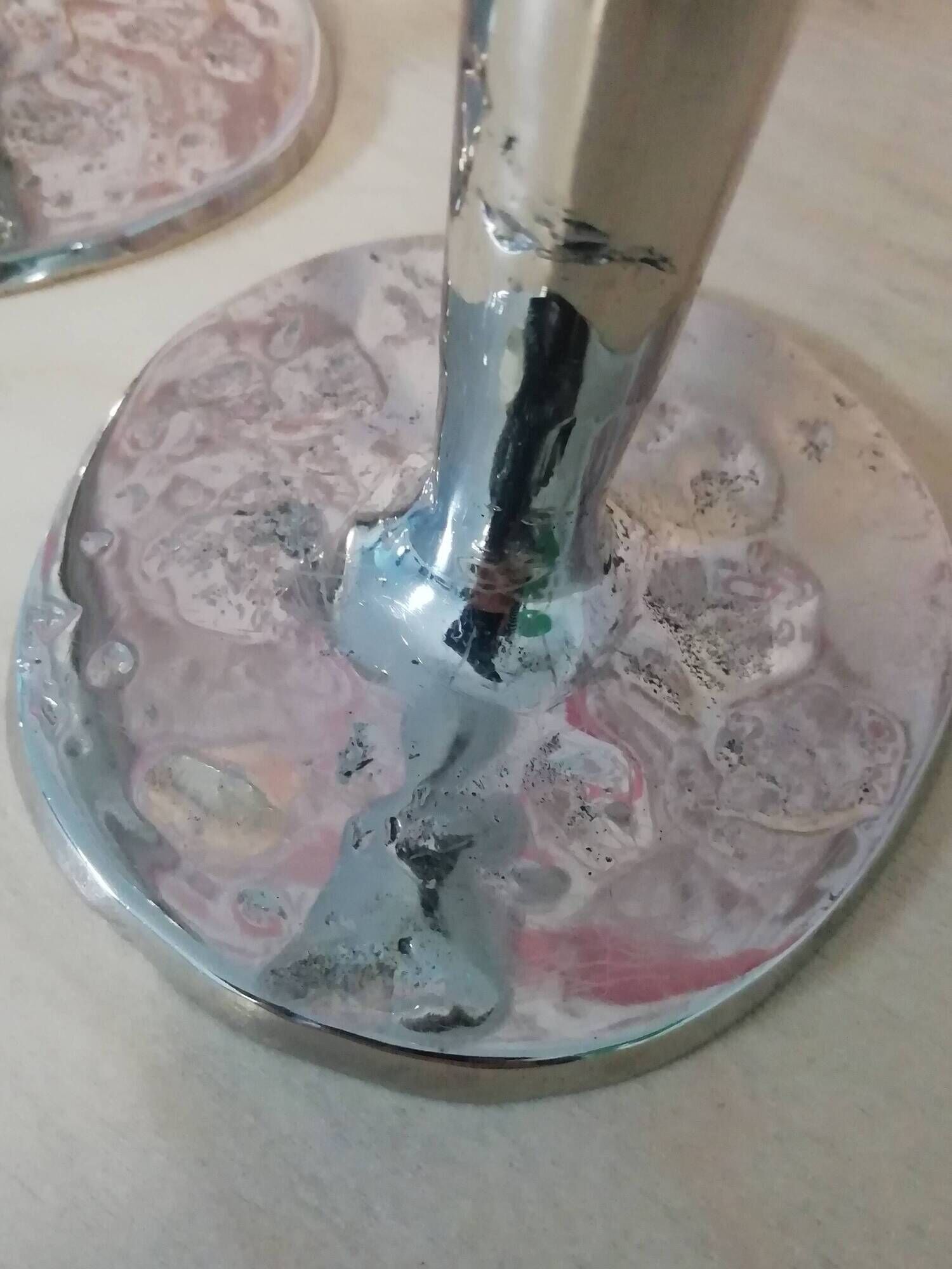 Pair of hammered metal candlesticks