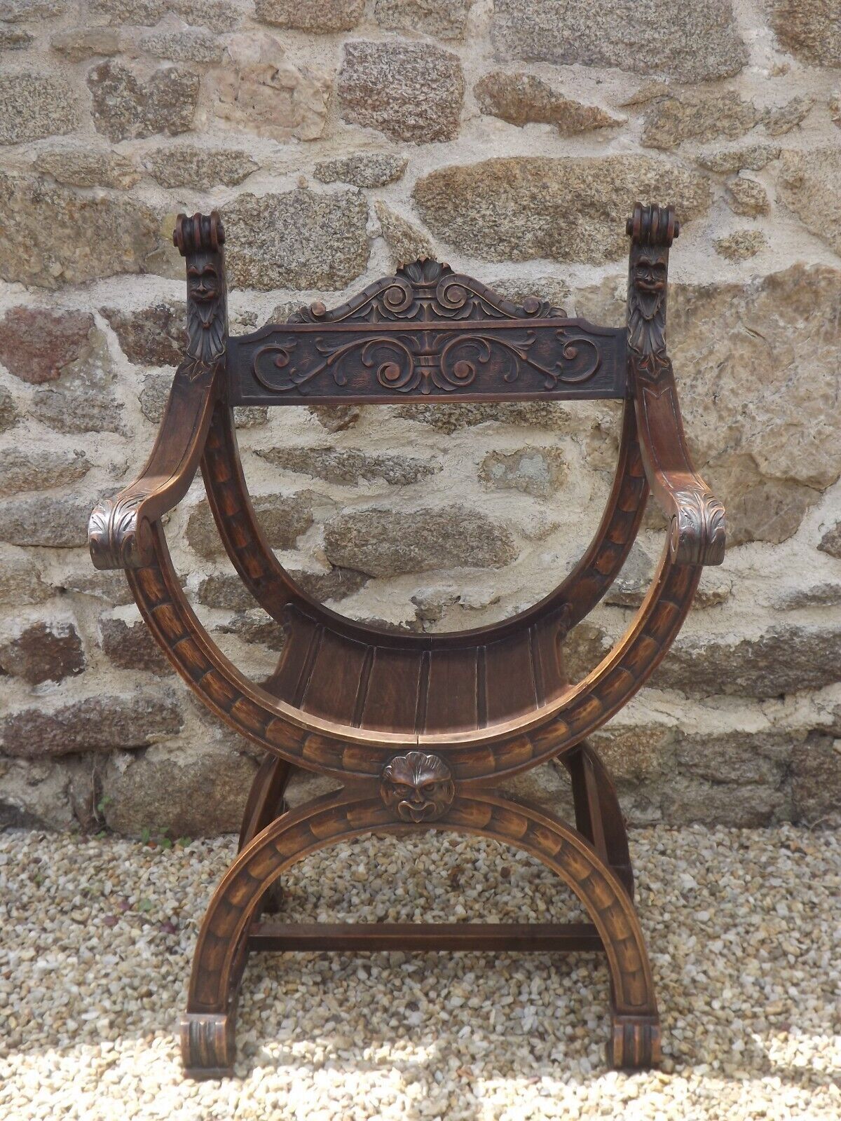 Dagobert armchair curule hard carved walnut demon head detail 3675