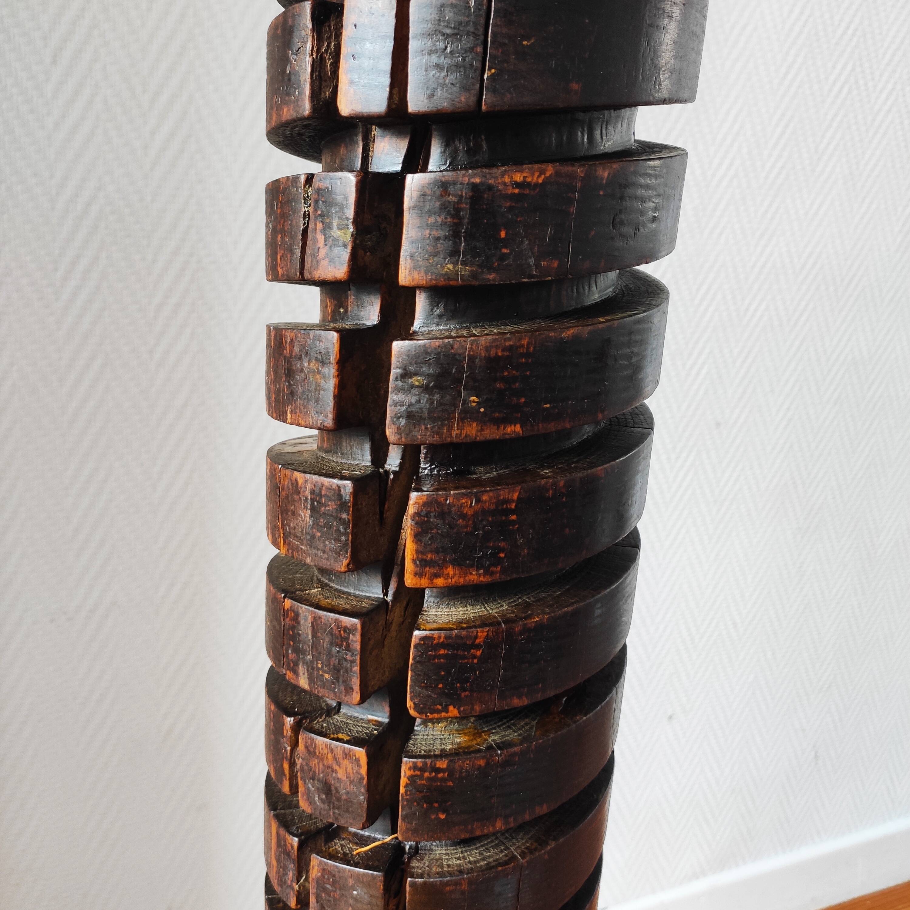 Brutalist column – old Burgundy press screw