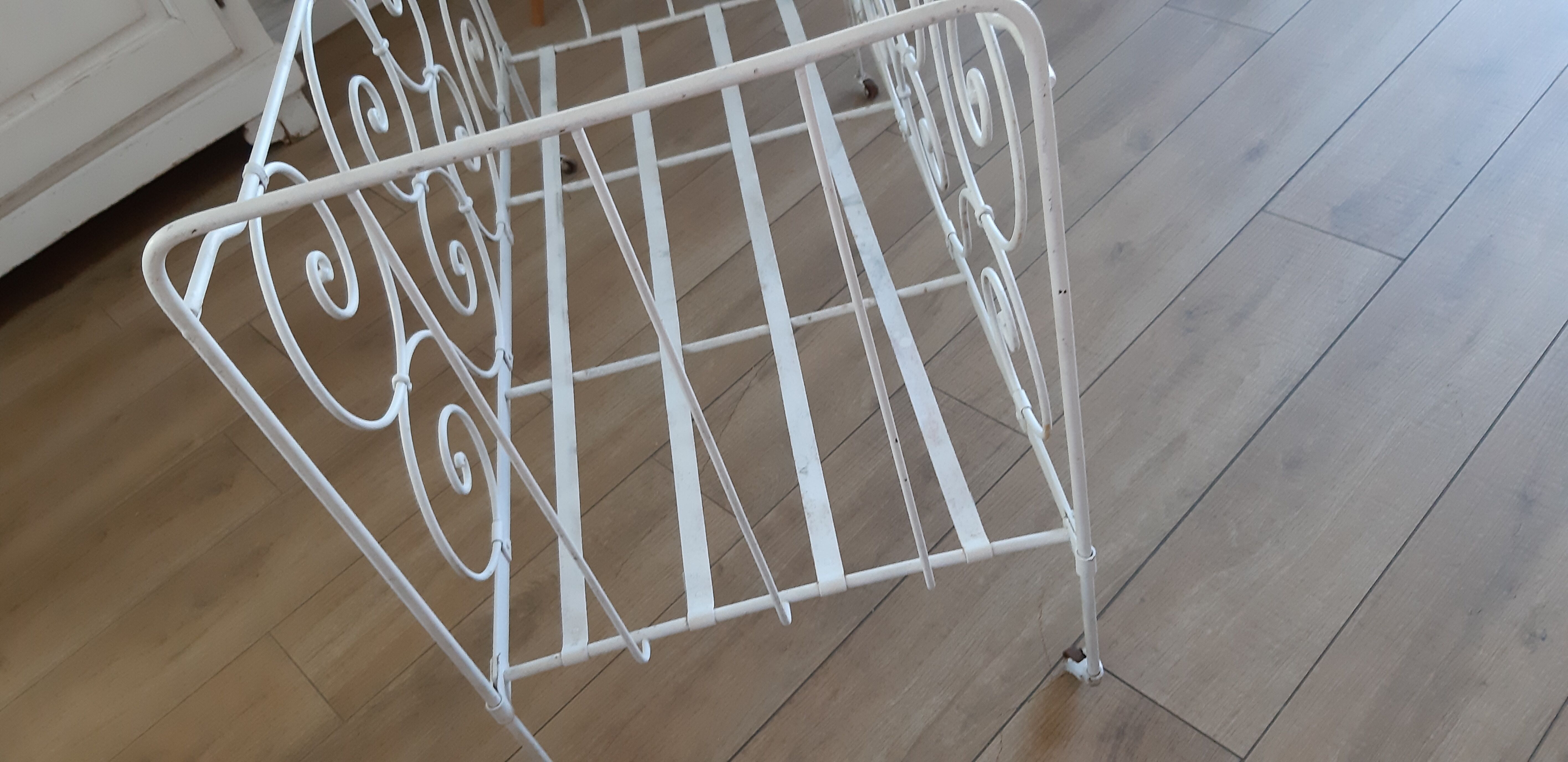 Wrought iron baby bed. Or bench seat of your choice