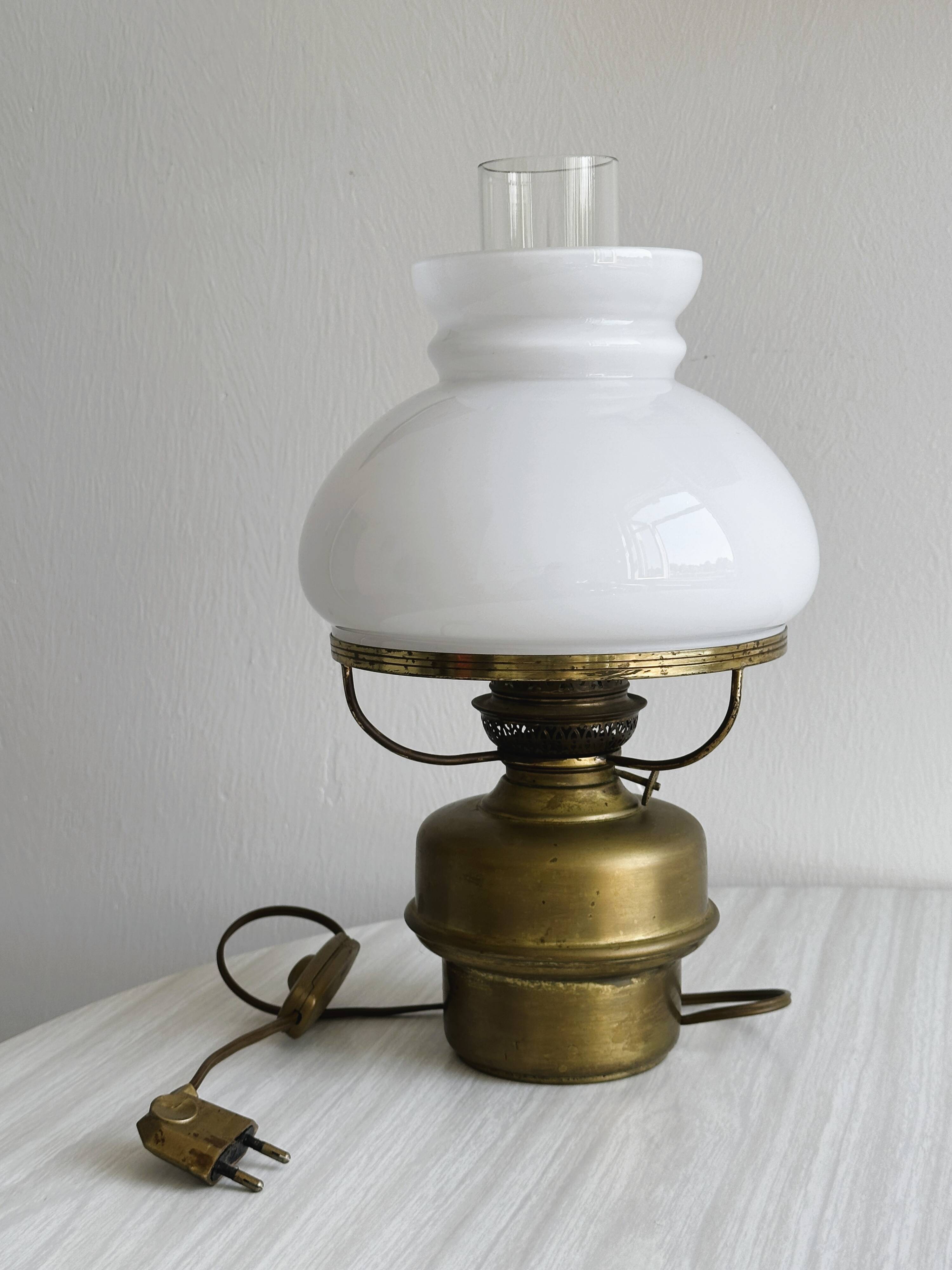 Vintage brass lamp with white opaline glass shade.