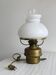 Vintage brass lamp with white opaline glass shade.