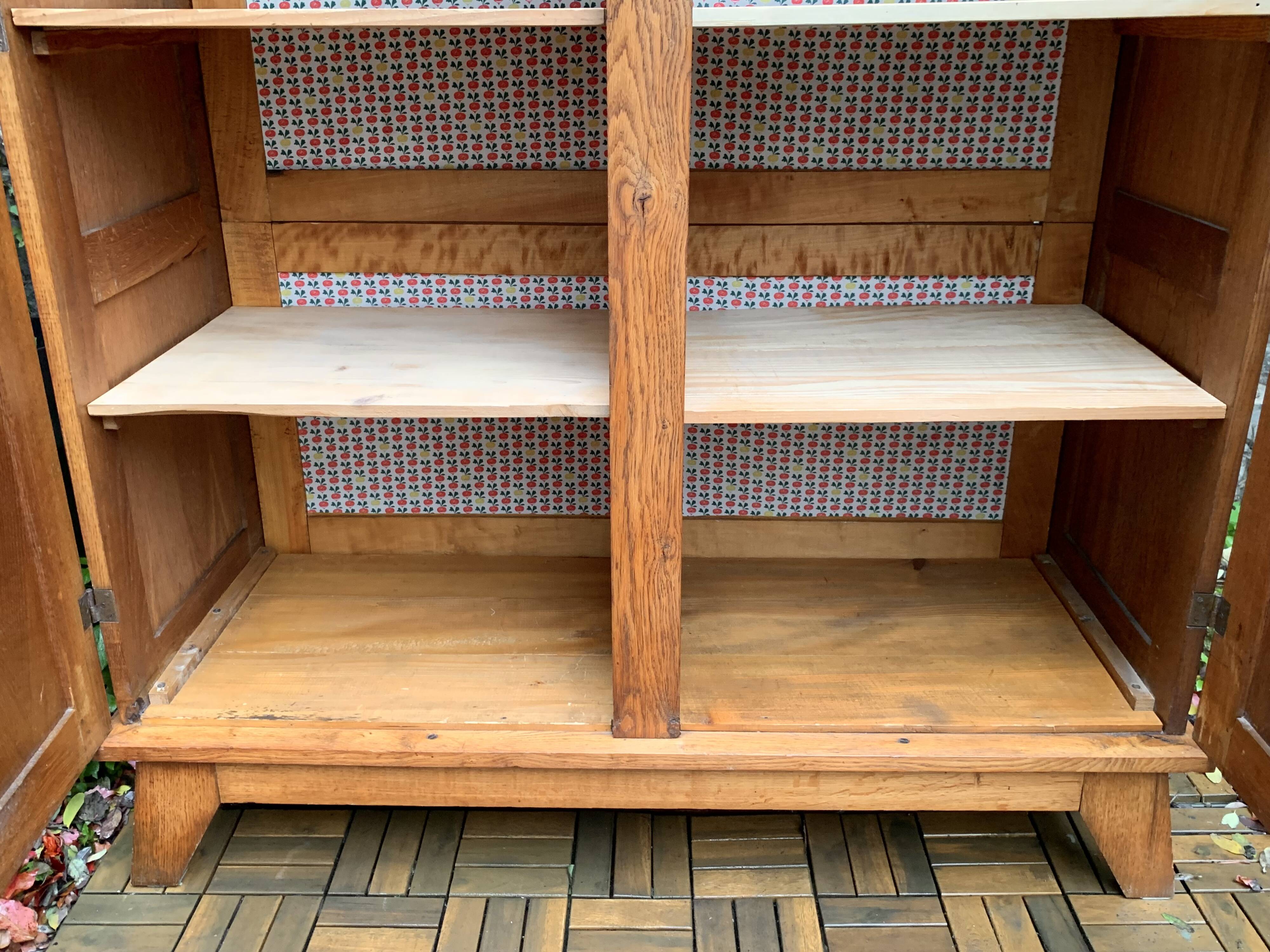 Solid oak compass foot cabinet René Gabriel 1945