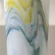 Tubular vase in white opaline, polychrome smoke volutes. Snowflake/Dalian Co. Ltd. High 29 cm
