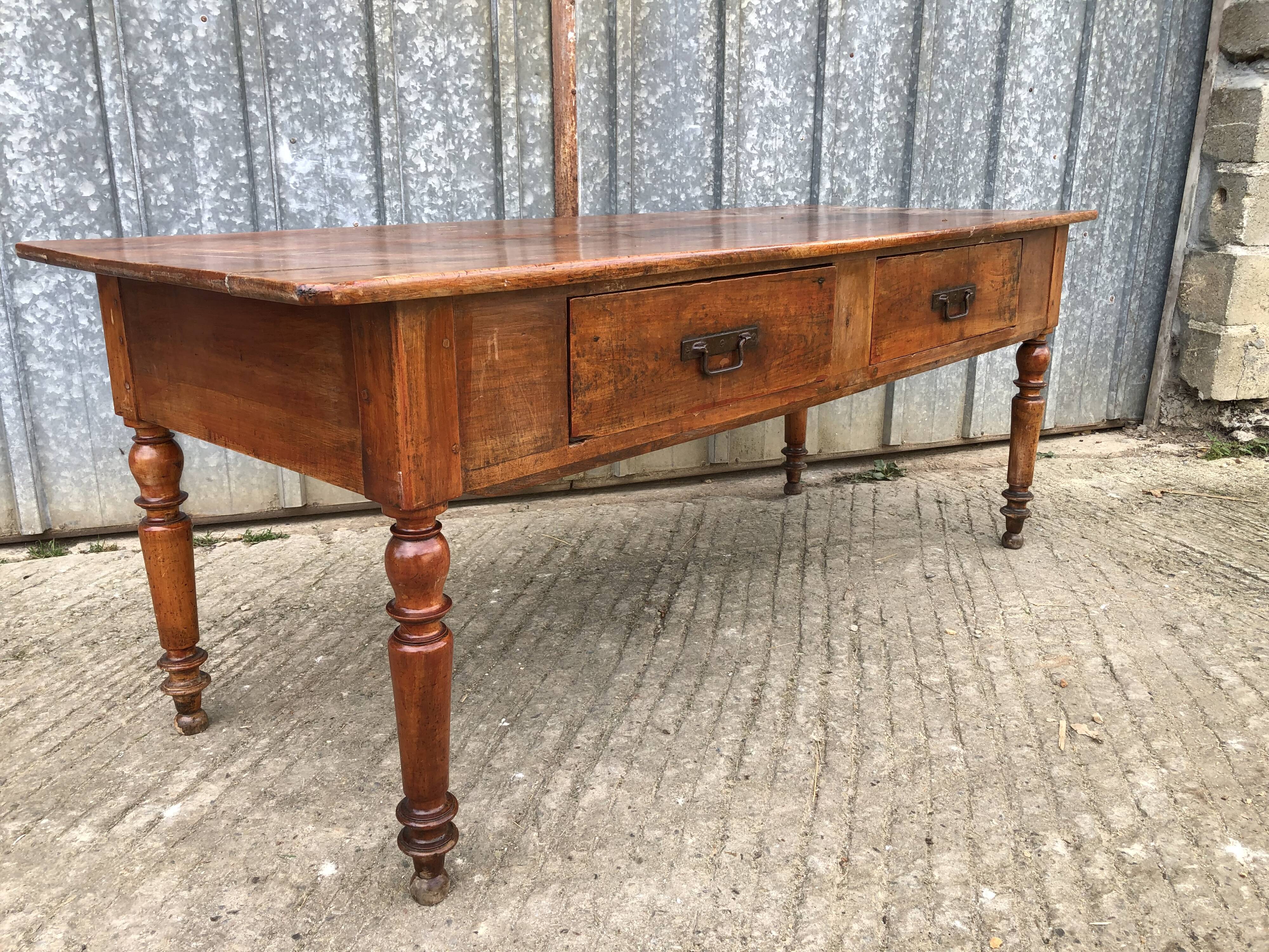 Old farmhouse table in solid cherry wood with 2 front drawers.