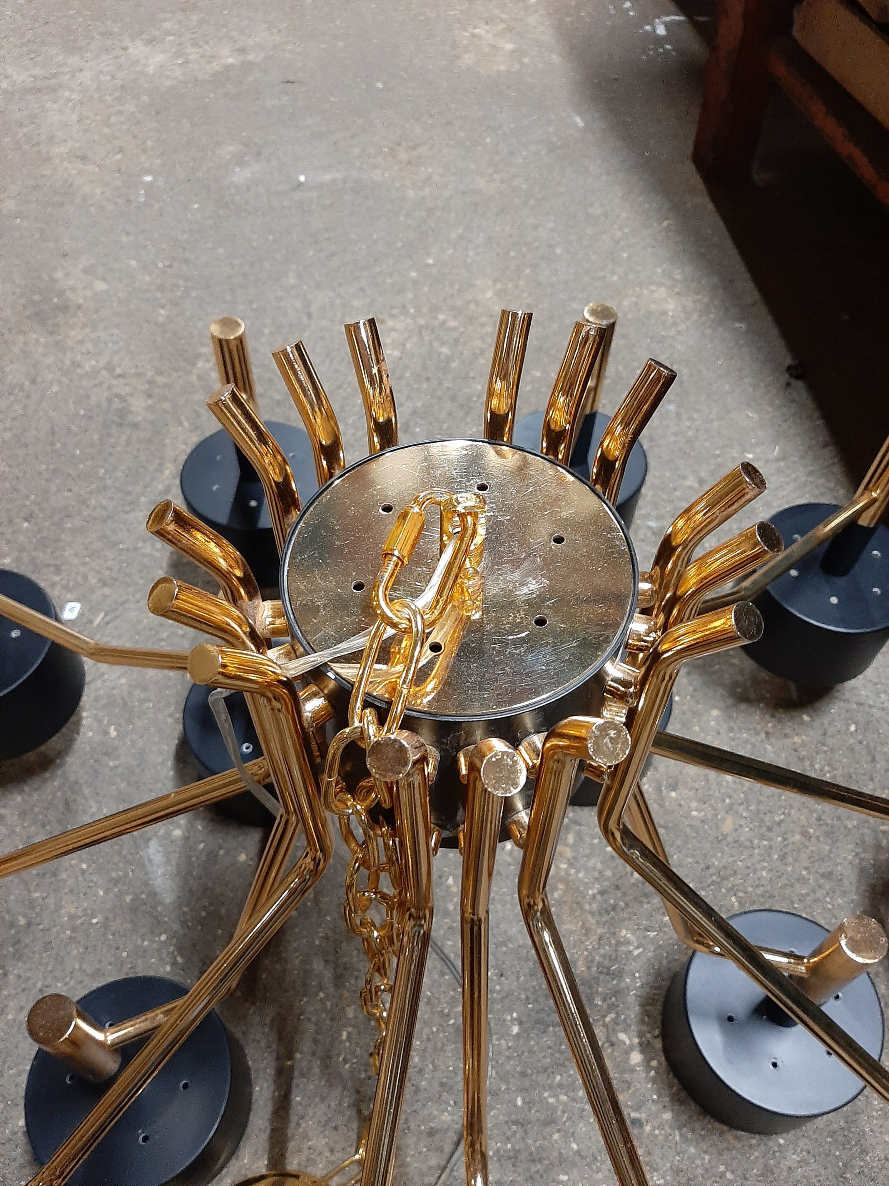 Black chandelier and gilded metal