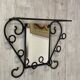 Wall-mounted coat rack with its mirror.