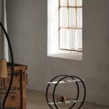 Decorative shelf unit, round metal frames with curved legs and glass shelves, 1960.