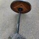 Round bistro table in cast iron and Bakelite, Louis Vuitton style, 1930s.