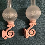 Original wall lights in pink enamelled cast iron with frosted glass globes.