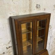 Oak display secretary cabinet with drop-down front, two sections.