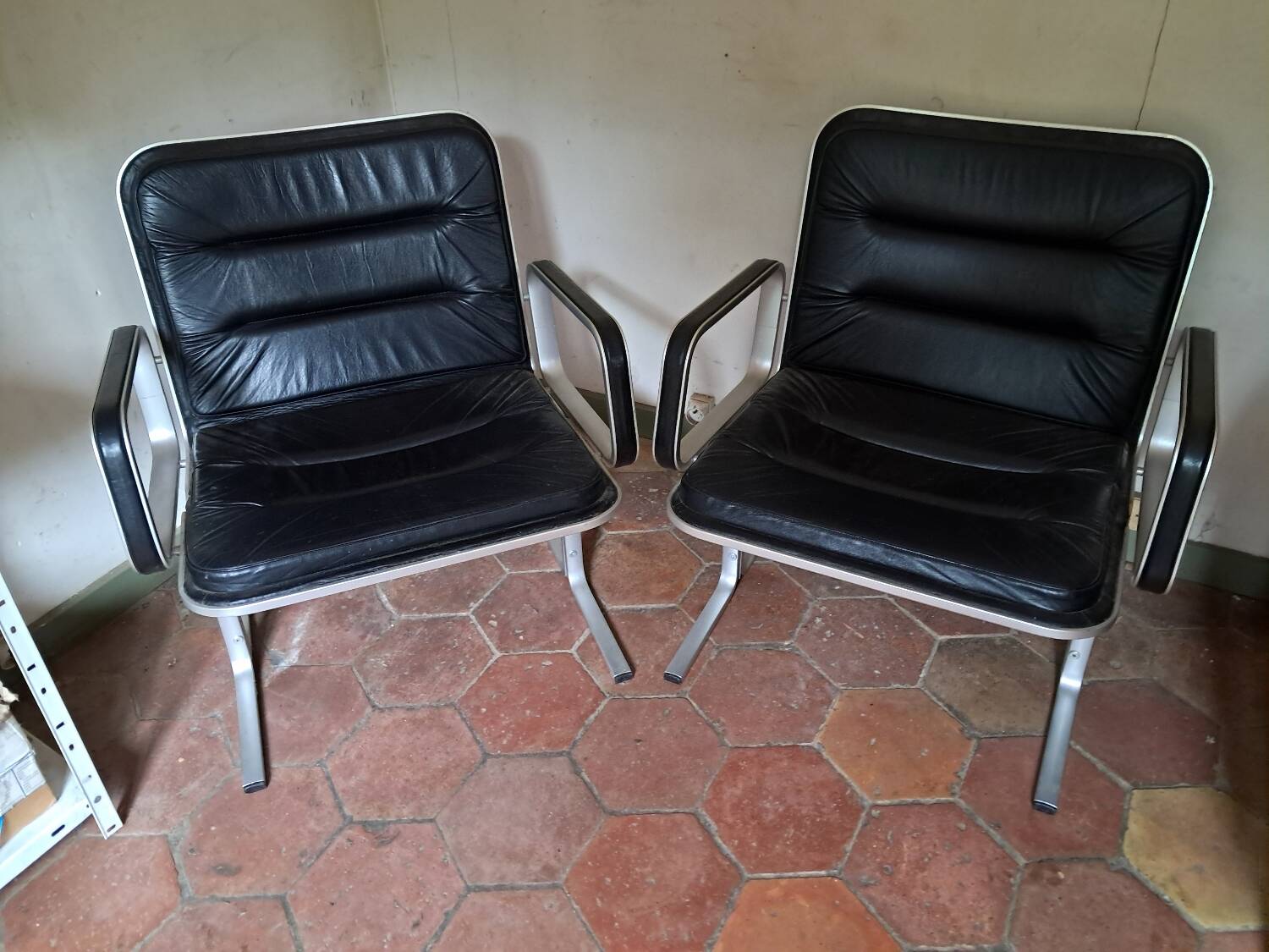 Pair of leather and aluminum armchairs