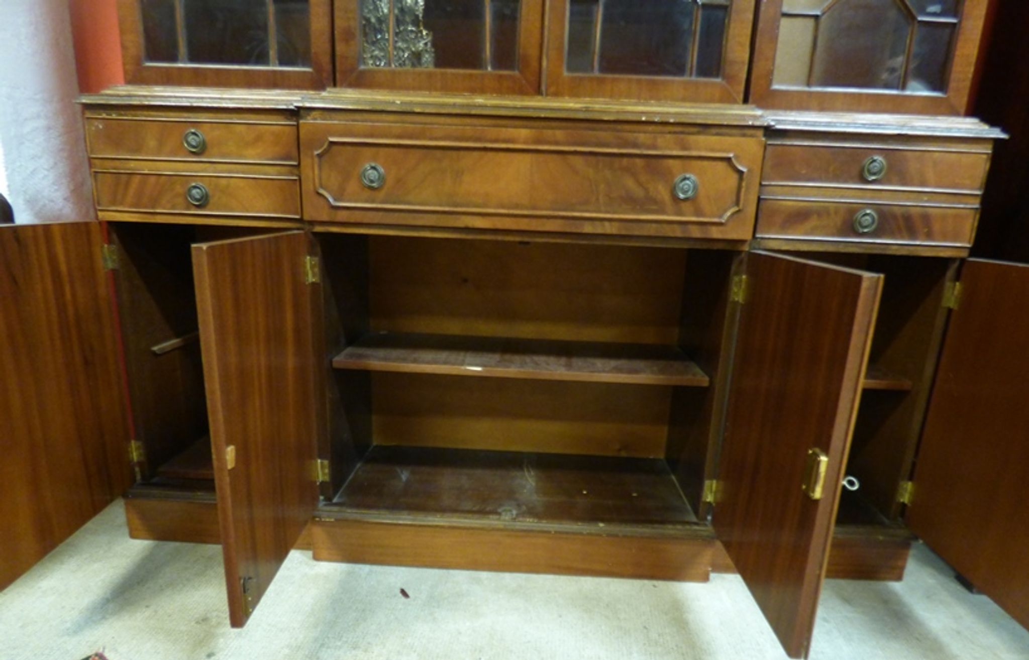 Scribanne bookcase in mahogany veneer English work of the twentieth century