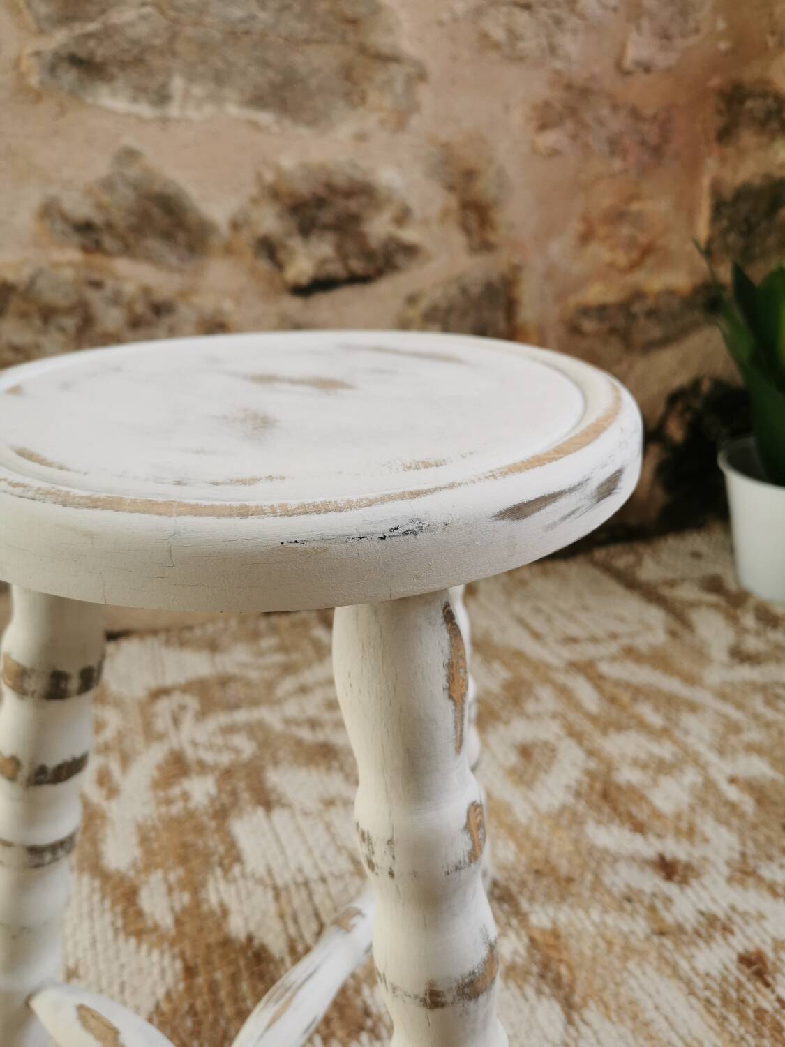 Tripod stool with patinated plant holder