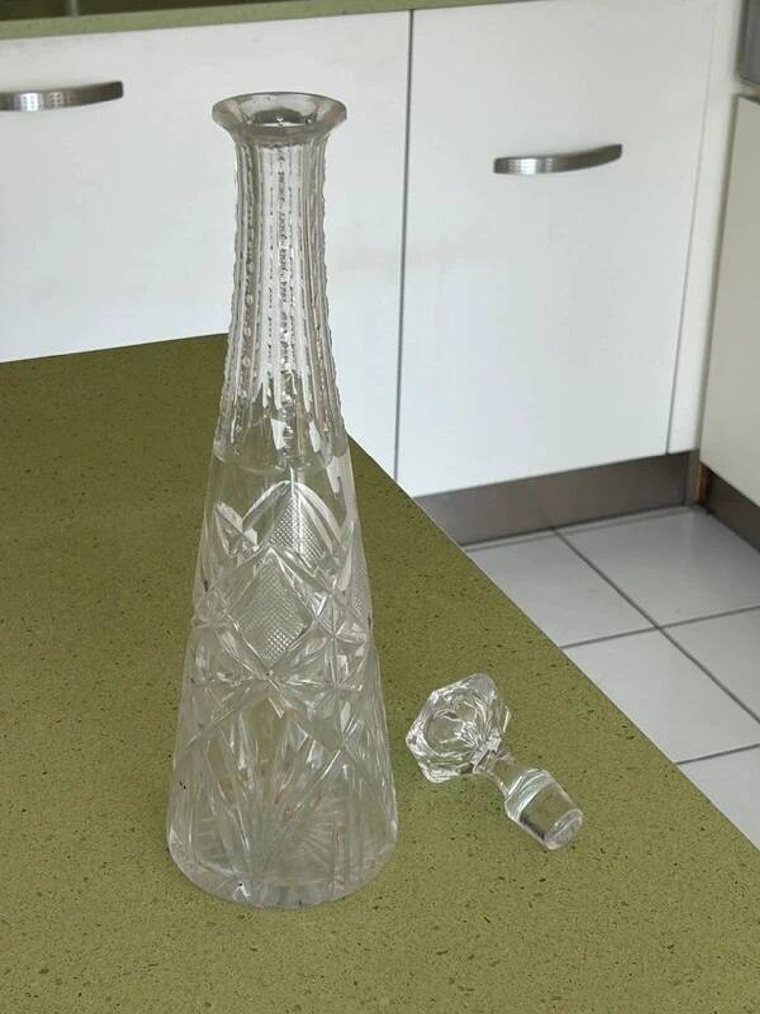 Long carafe with a cut Bohemian crystal stopper, design decor, 38.5 cm.