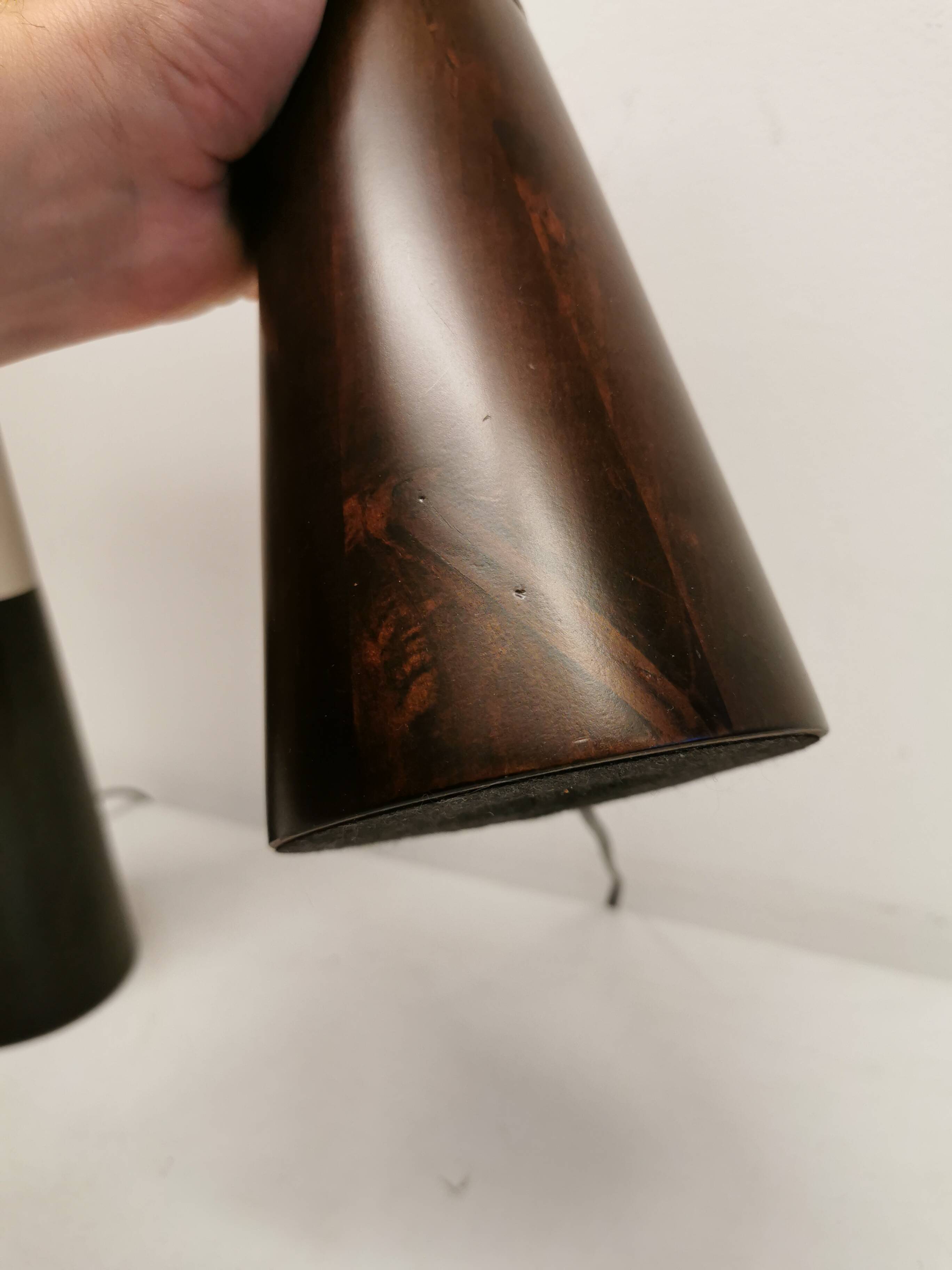 Two table lamps made of dark-stained wood with silver detail in the middle.