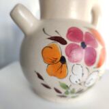 Pitcher ball in sandstone with floral pattern