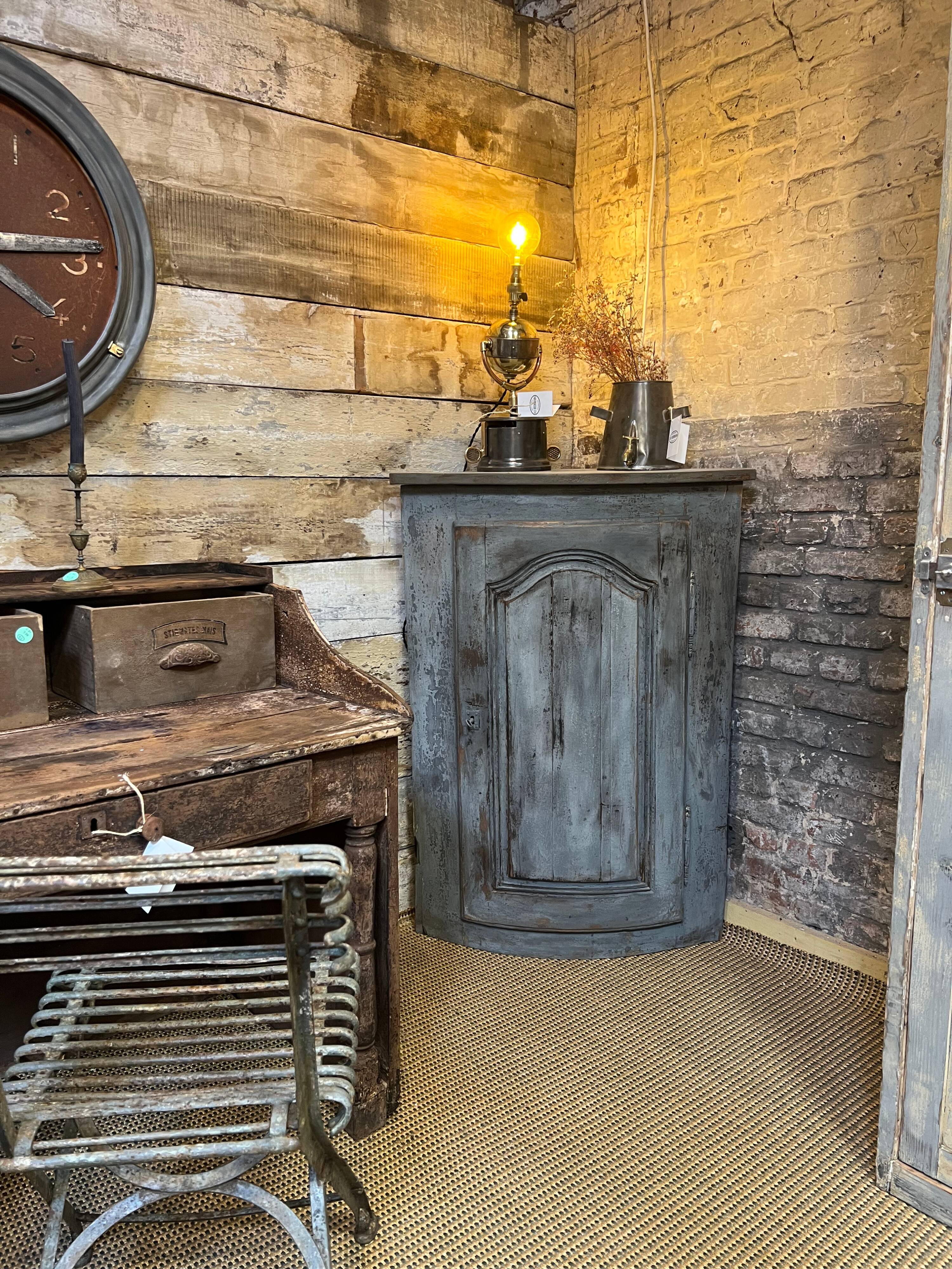 Eighteenth-century corner cabinet with a patina.