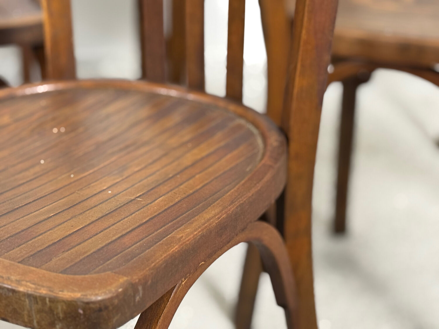 Set of 17 vintage bistro chairs in curved wood — striped seat, be