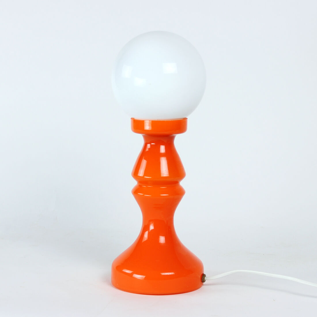 Orange glass table lamp by vitropol, poland 1960s