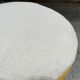 Rattan pouf with refurbished cushion