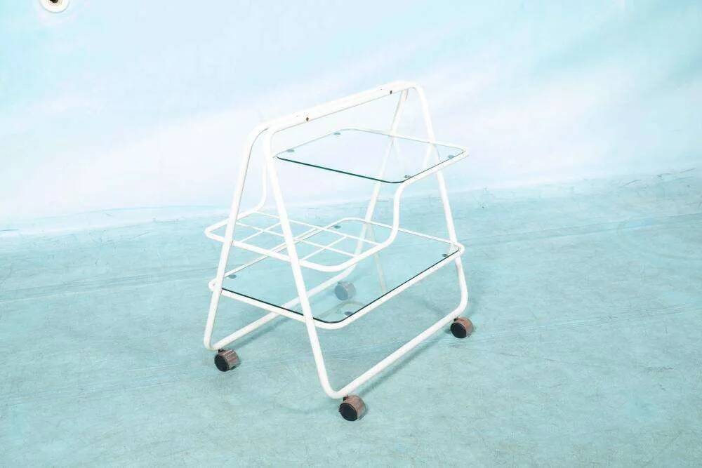 Space age dessert trolley from the 1970s, with metal tubes and glass trays.