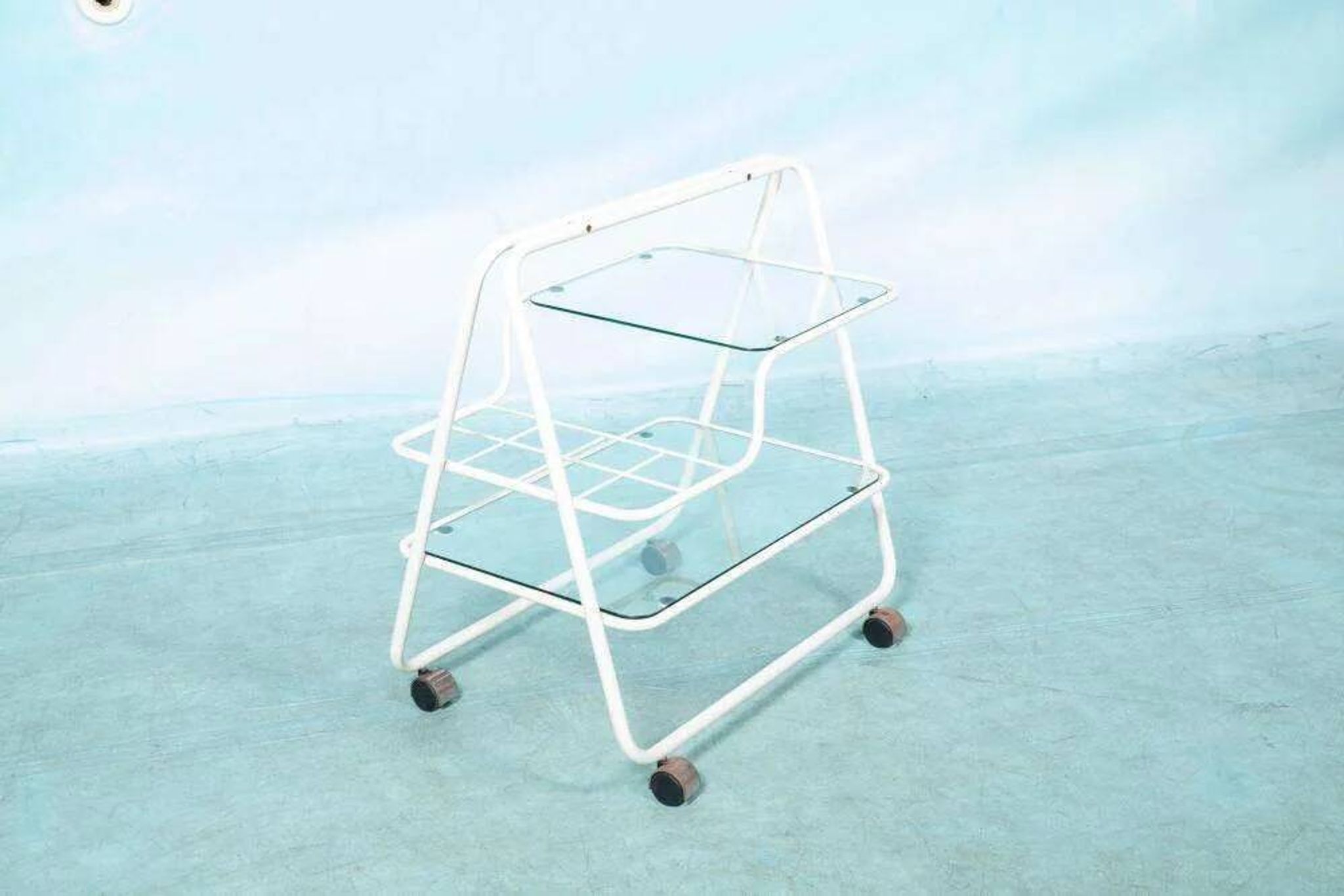 Space age dessert trolley from the 1970s, with metal tubes and glass trays.