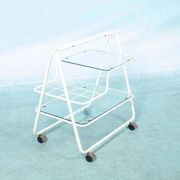 Space age dessert trolley from the 1970s, with metal tubes and glass trays.