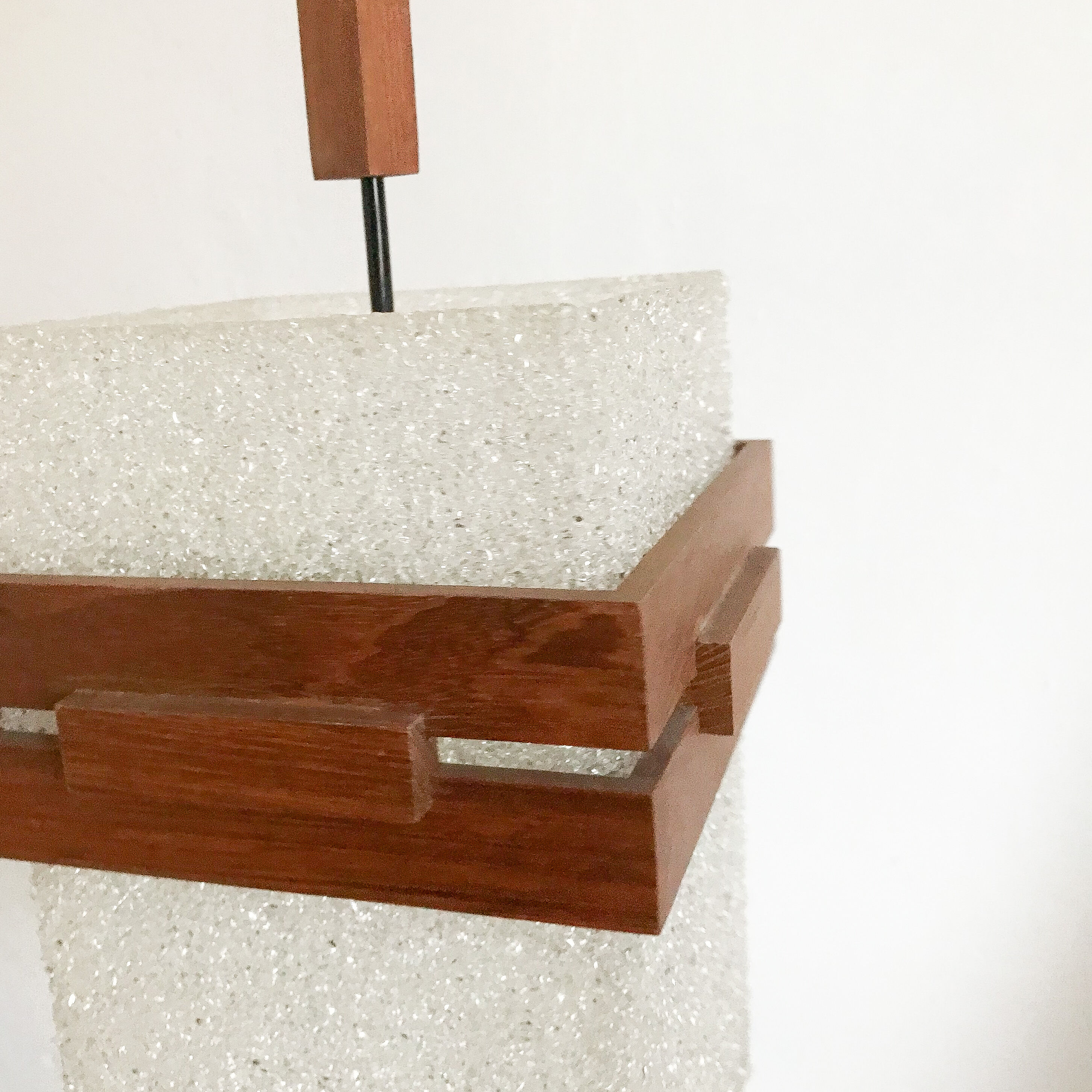 Suspension in perspex and teak