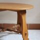 Round beech coffee table with curved legs, 1980s.