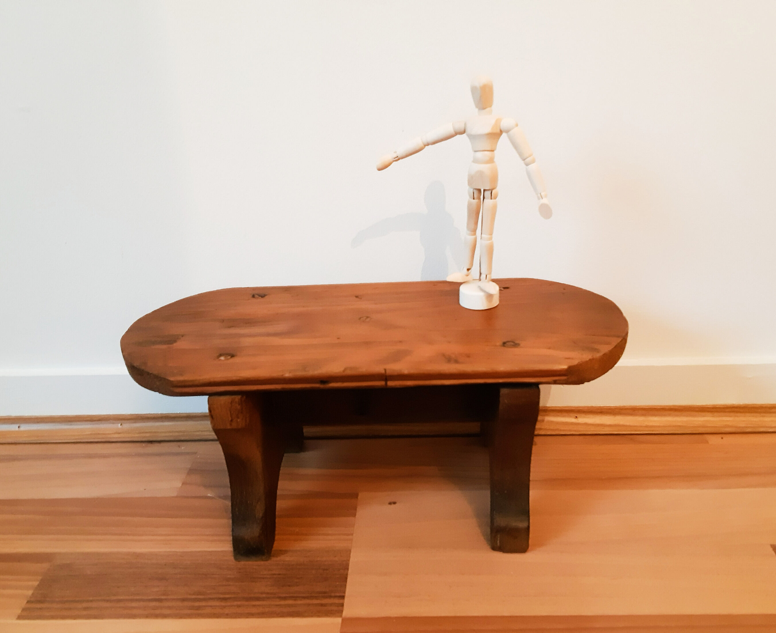 Low milking stool in waxed wood