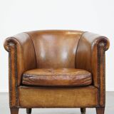 Club chair made of sheepskin leather with the most beautiful colors and a stunning patina